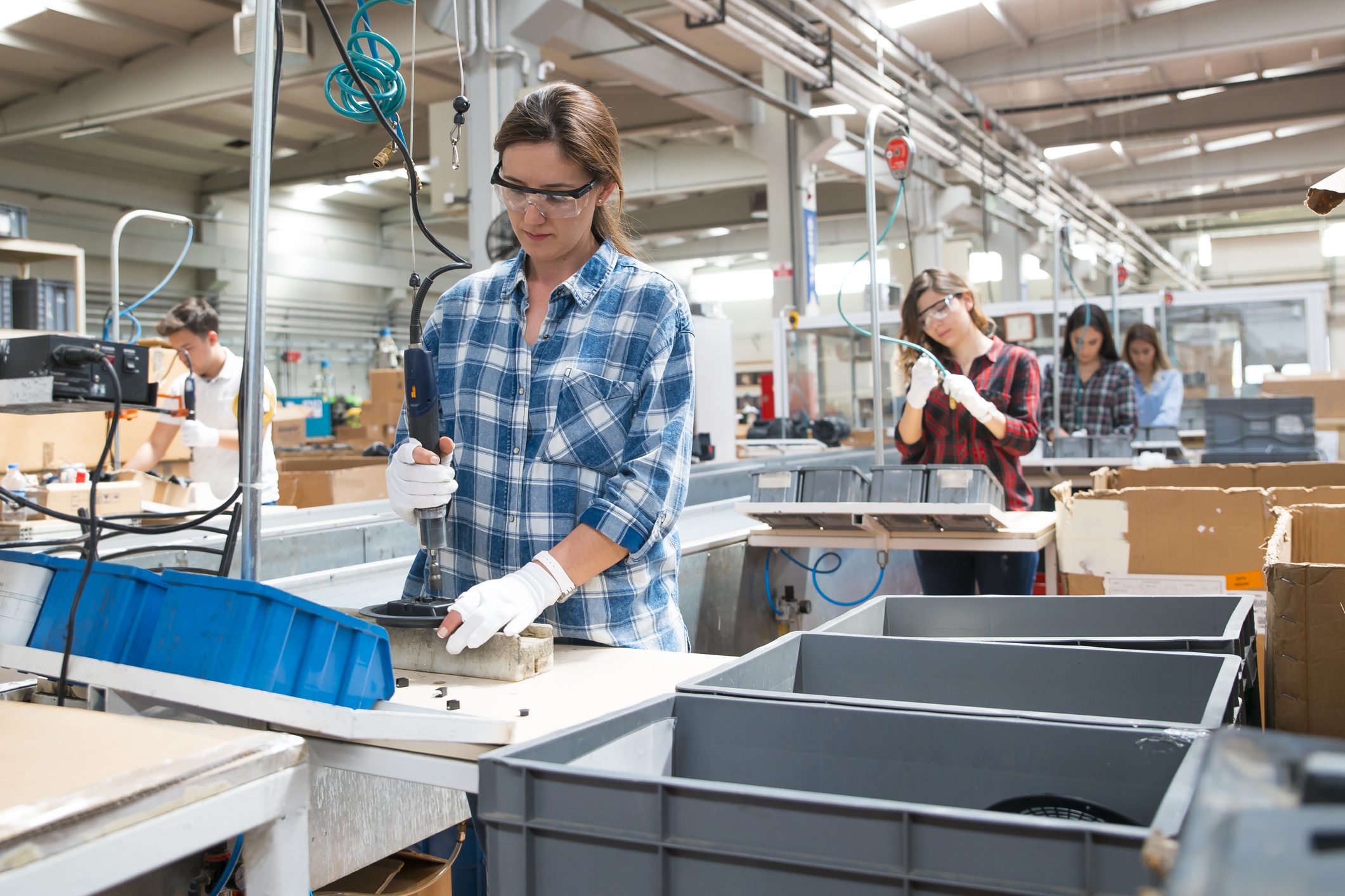 Women working in a manufacturing assembly line.